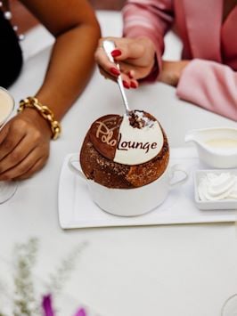 models enjoying soufflé in the Polo Lounge
