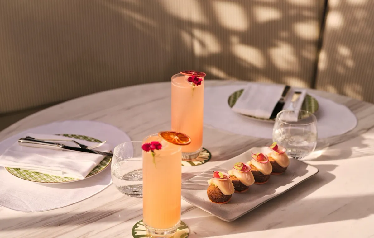 Image of Veranda design and food at The Lana - Dorchester Collection