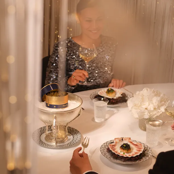 The Dorchester Alain Ducasse Table Lumier - people eating dinner, enjoying wine