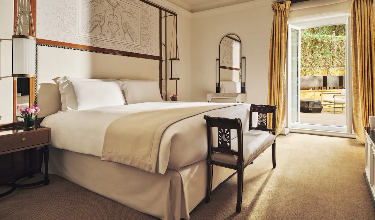 Aurora Terrace Suite bedroom with open window onto private terrace