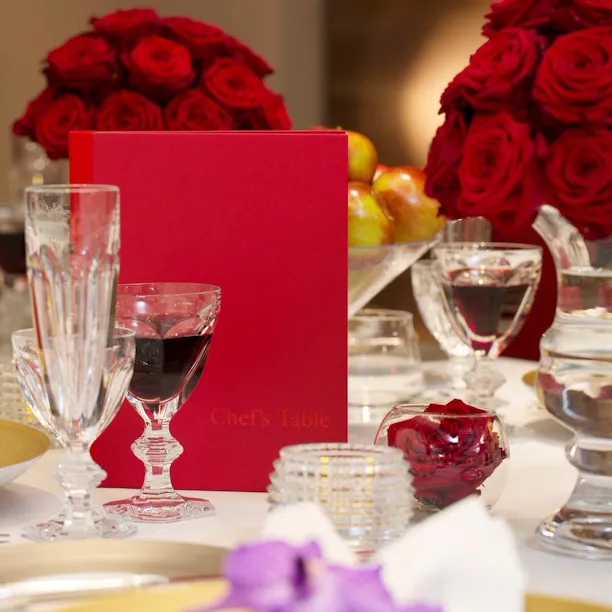 Chef's Table detail red flowers with wine
