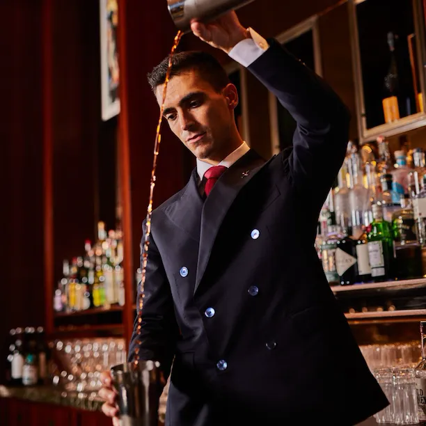 Daniele Celli, the bar manager, making cocktails