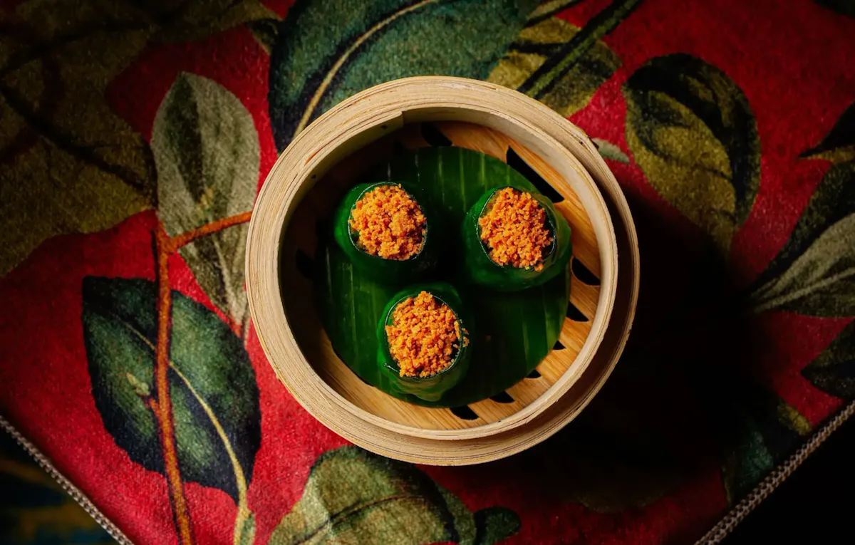 Food dish at China Tang at The Dorchester in soft lighting. Vibrant ingredients
