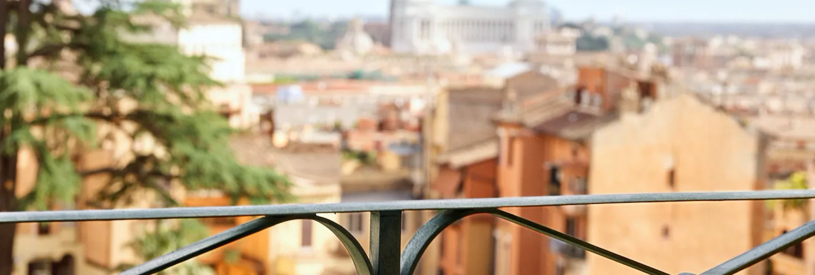 Balcony railing of Classic suite with view at Hotel Eden with view of Rome in the background