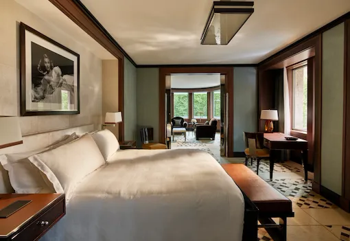 Park suite bedroom showing wrap around living room at 45 Park Lane, London