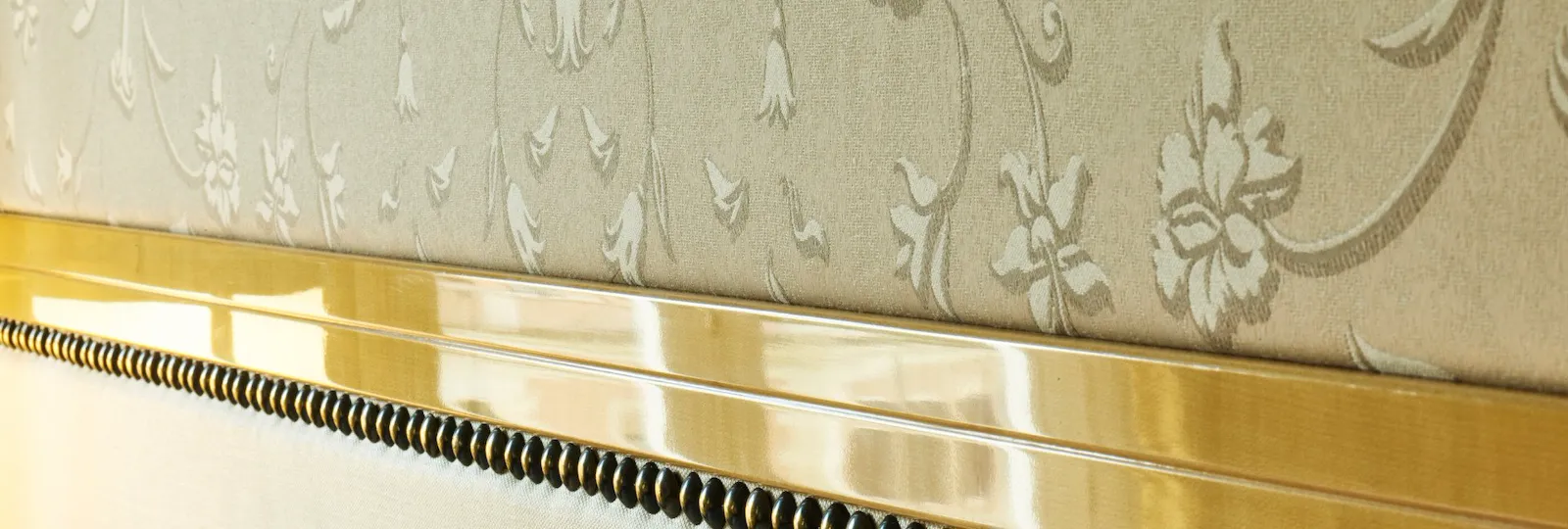 Detail of bed headboard inside Junior Suite at Hotel Eden, Rome