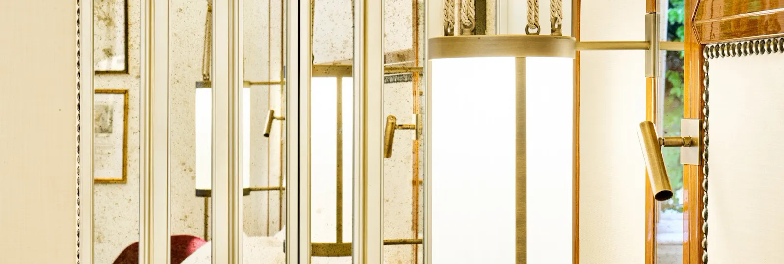 Lit lamp and wardrobe inside bedroom of Classic Suite at Hotel Eden, Rome