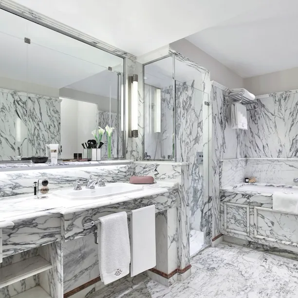 Marble bathroom in a superior room with balcony, with a bathtub. At Le Meurice, Paris.