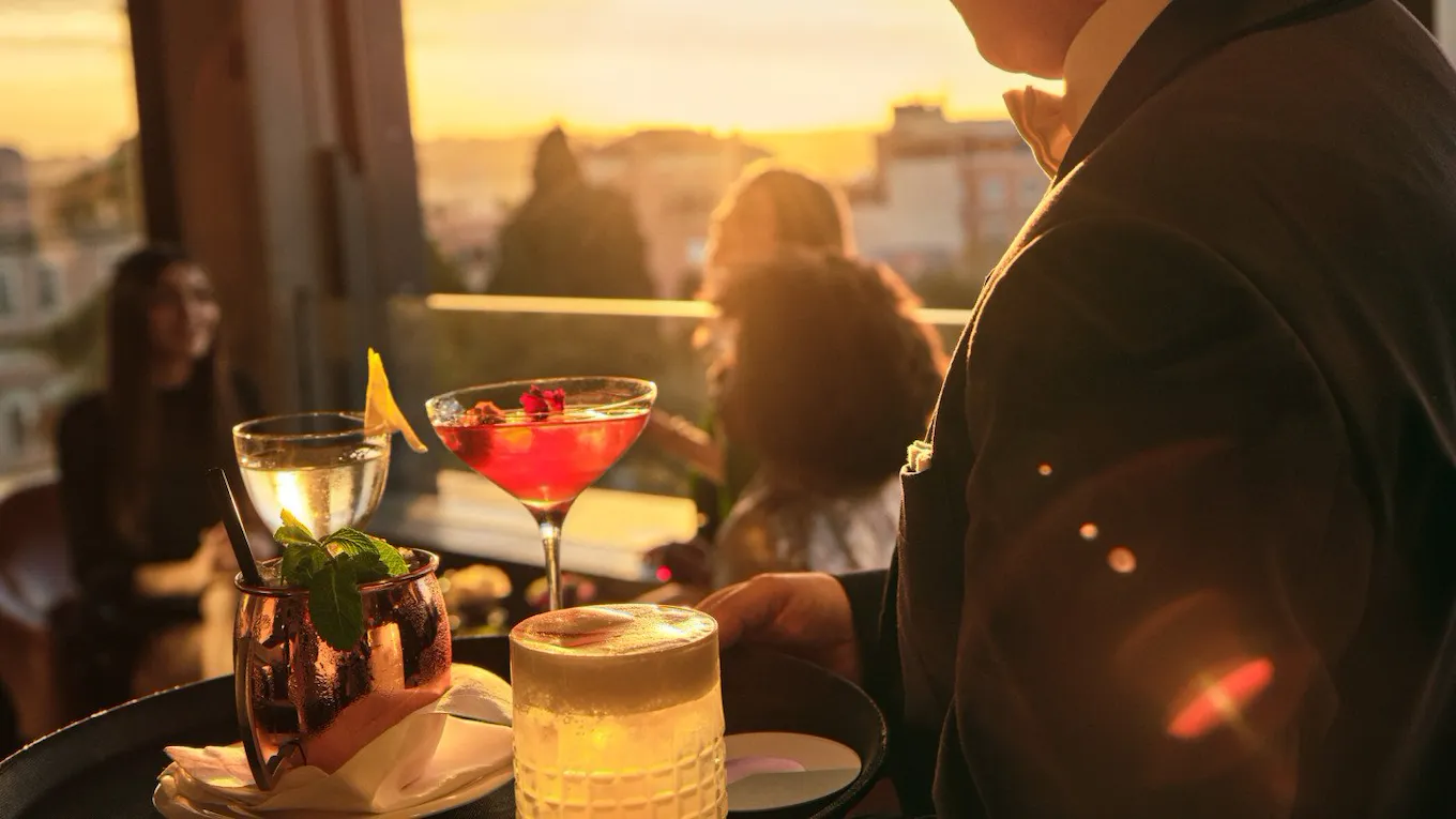 Barman serving drinks at Il Giardino Bar