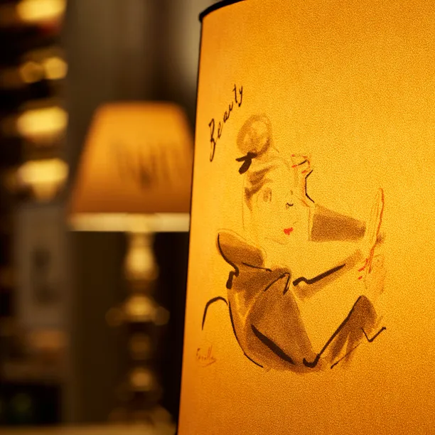 Lampshade with illustrations by Italian fashion illustrator Andrea Ferolla at La Libreria at Hotel Eden, Rome
