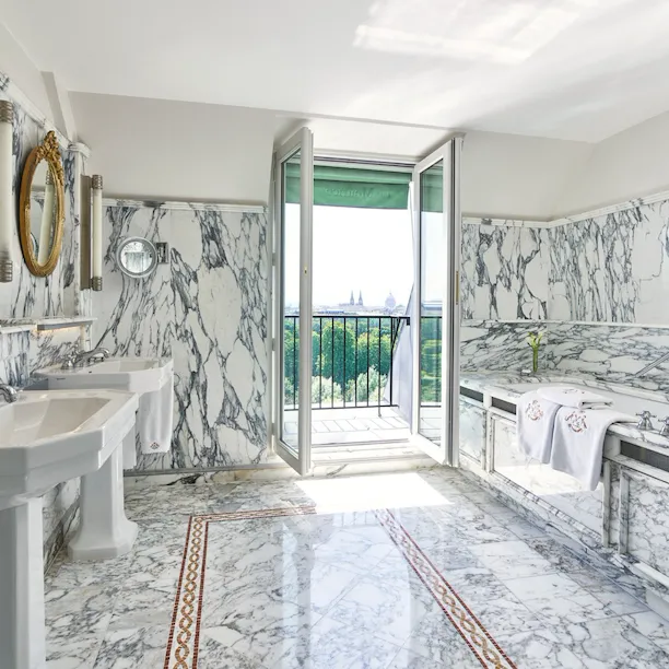Marble bathroom with bathtub overlooking the Tuileries gardens in an executive room. At Le Meurice, Paris.