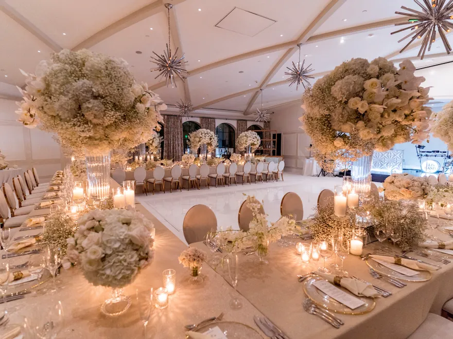 U-Shaped table around white dancefloor for wedding at Hotel Bel-Air