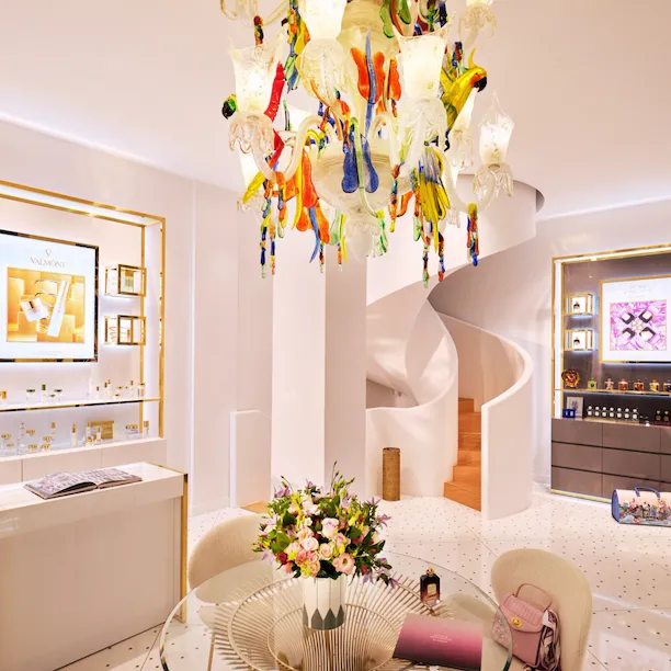 Large view of the store with props on a table at La Maison Valmont pour Le Meurice, Paris - Dorchester Collection