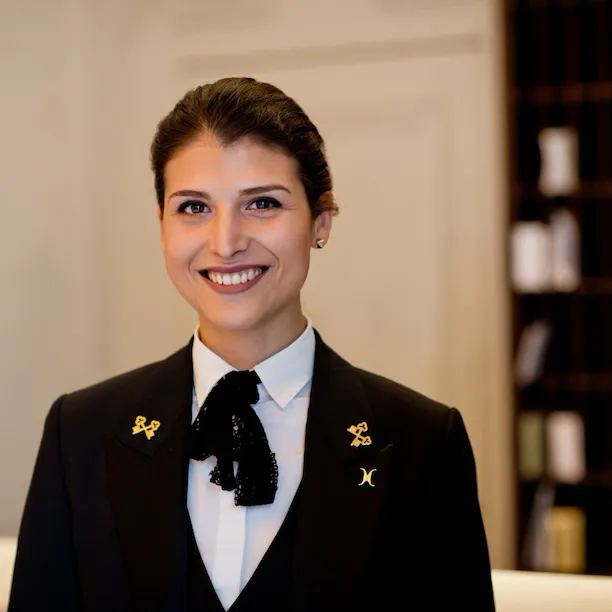 Portrait of Ana De Castro, Concierge, at concierge desk at Hotel Eden, Rome