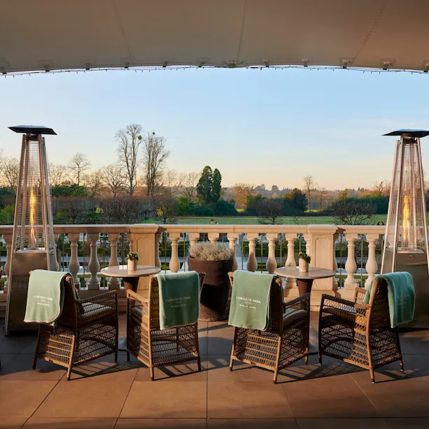 Coworth Park Drawing Room terrace with views of the winter countryside