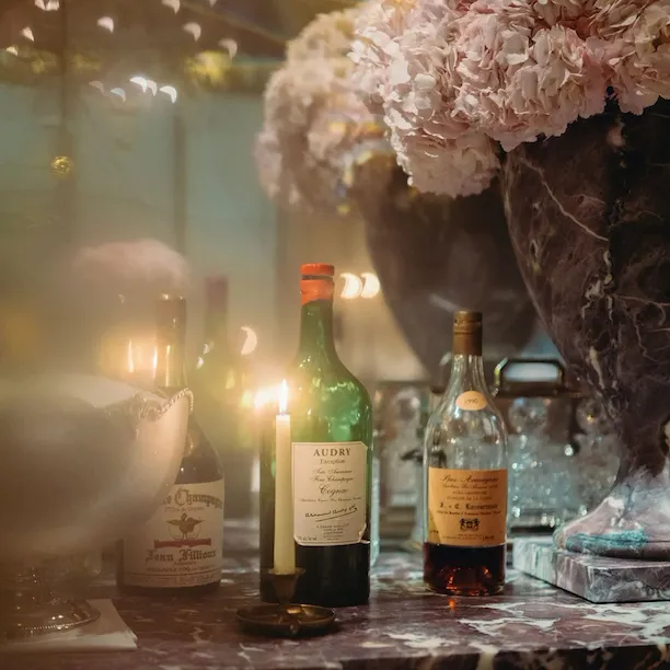 Picture of alcool bottles on the Jean Imbert au Plaza Athénée restaurant marble table.