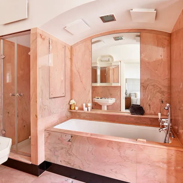 The Dorchester Harlequin Penthouse bathroom with light pink marble detailing